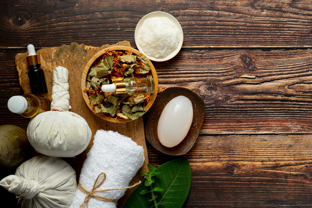 herbal spa treatment equipments put on wooden floor